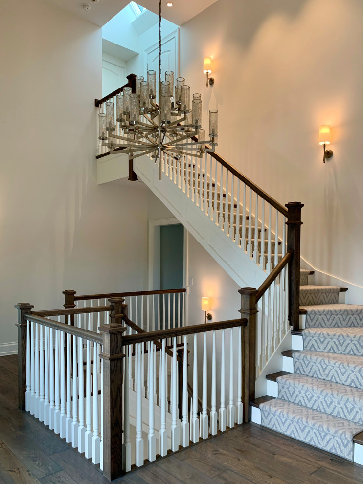 Example of a trendy wooden u-shaped wood railing staircase design in Chicago with wooden risers