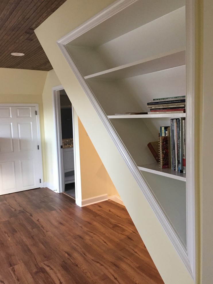 Large elegant loft-style vinyl floor home design photo with yellow walls