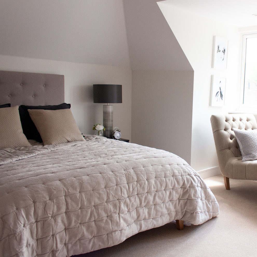 This is an example of a medium sized modern bedroom in Hertfordshire.