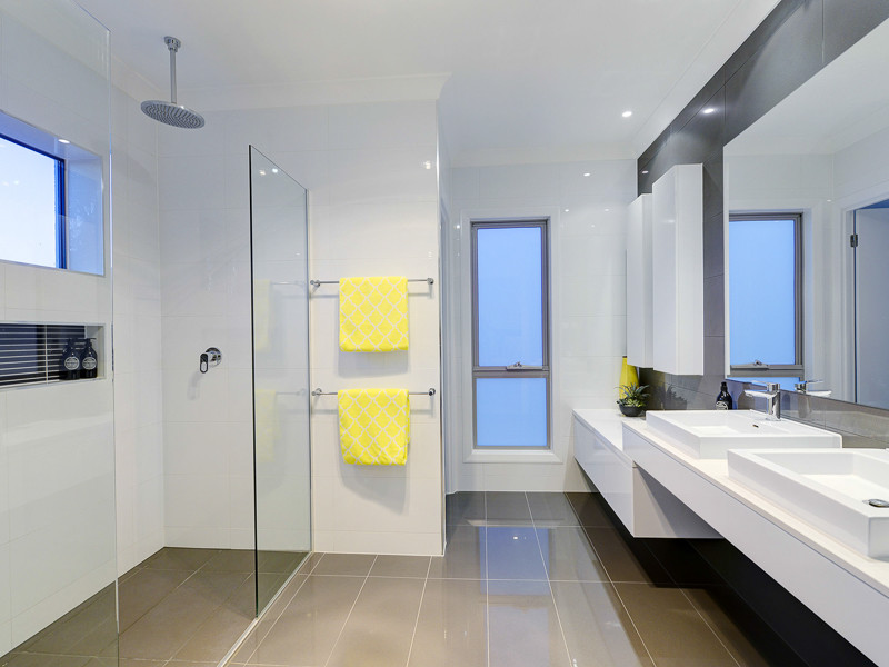 Design ideas for a mid-sized contemporary master bathroom in Brisbane with a vessel sink, flat-panel cabinets, white cabinets, engineered quartz benchtops, a double shower, a one-piece toilet, gray tile, porcelain tile, white walls and porcelain floors.