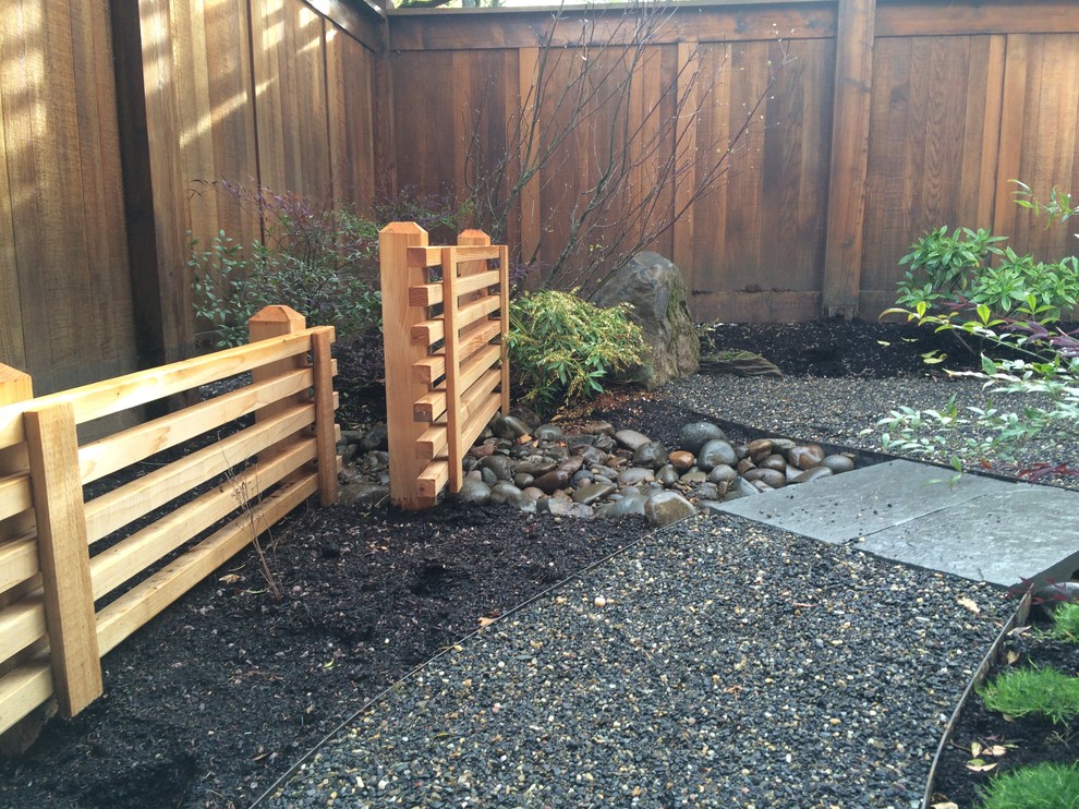 Design ideas for a small asian courtyard garden in Portland with gravel.