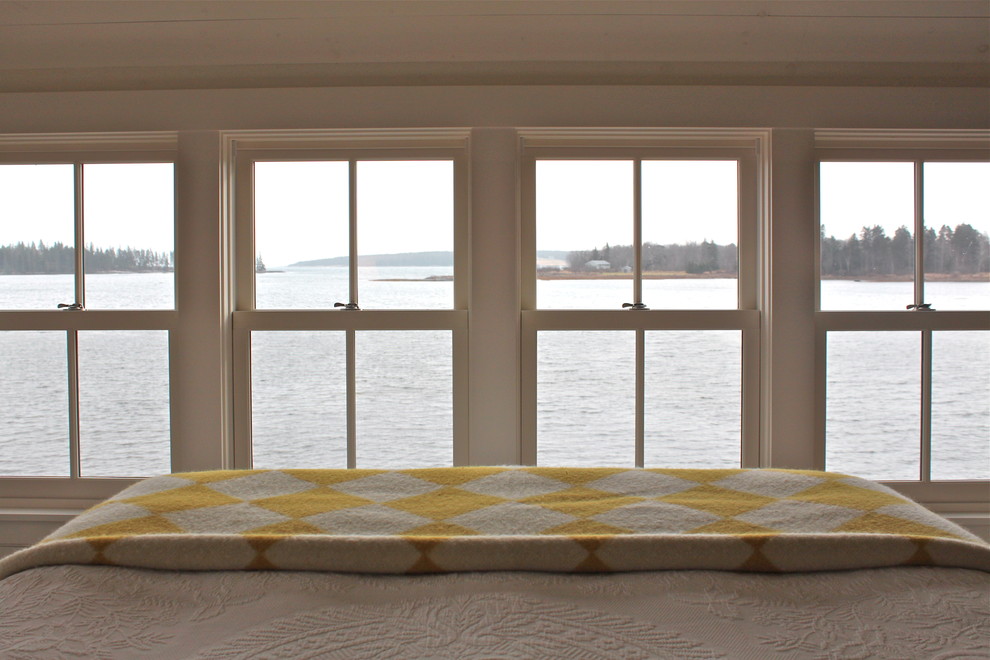 Country bedroom in Portland Maine with white walls.