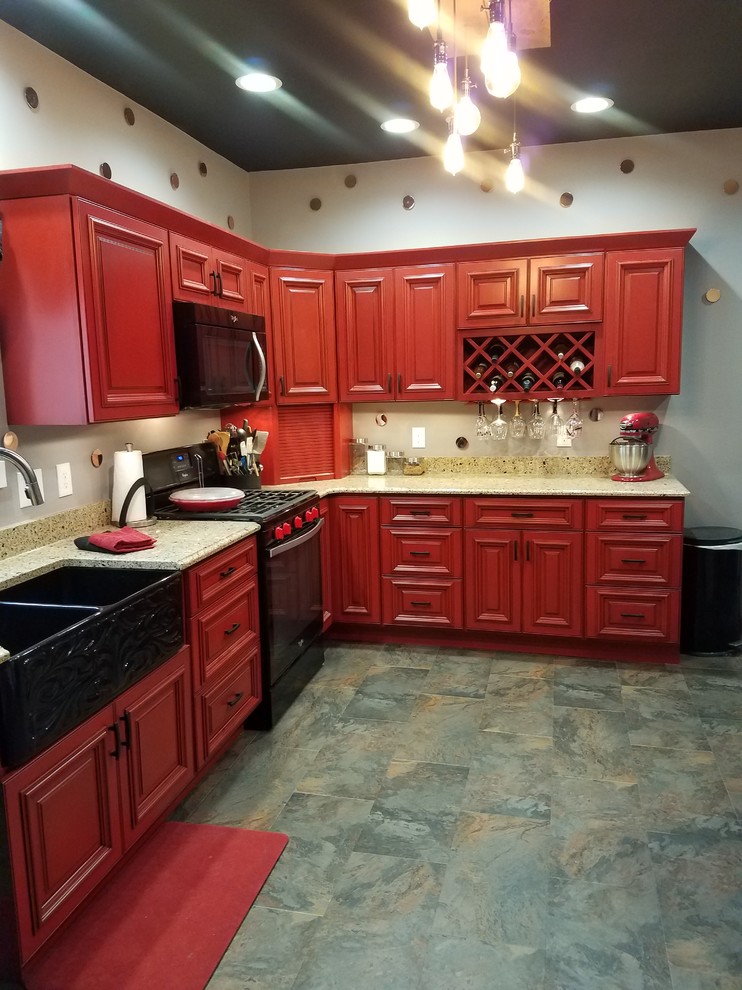 Kitchen pantry - l-shaped slate floor and multicolored floor kitchen pantry idea in Cedar Rapids with a double-bowl sink, beaded inset cabinets, red cabinets, black appliances, no island and brown countertops