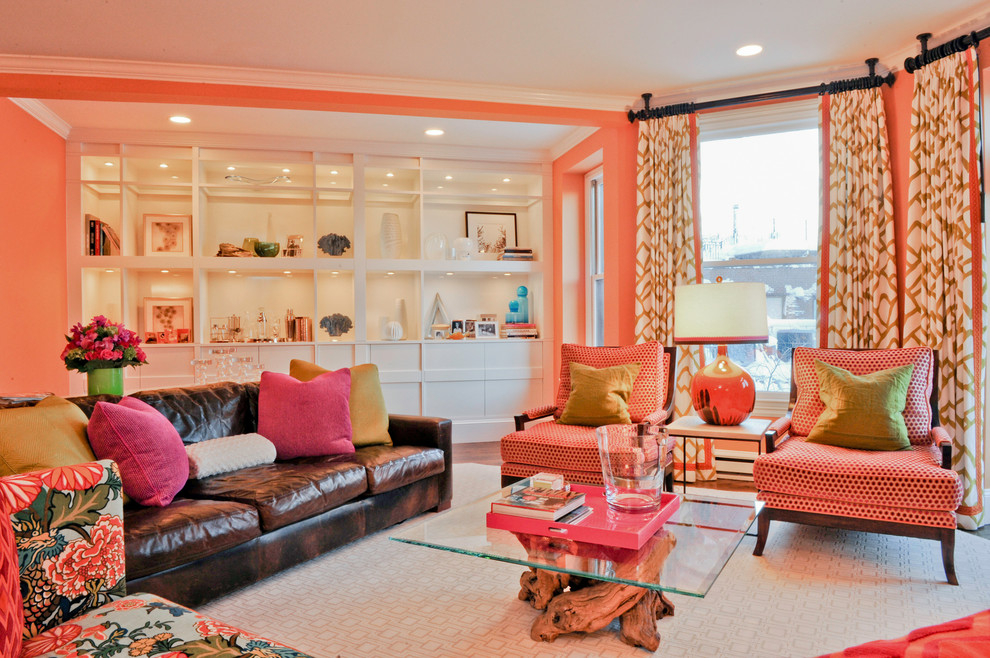 Design ideas for an eclectic living room in Boston with orange walls.