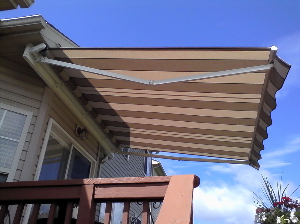 This is an example of a country deck in Baltimore with an awning.