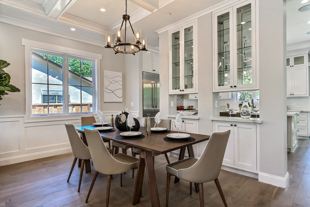 Photo of a mid-sized arts and crafts open plan dining in San Francisco with grey walls, medium hardwood floors, grey floor, coffered and panelled walls.