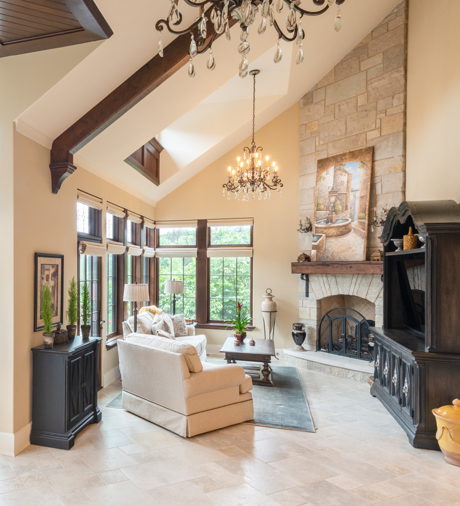 Elegant beige floor living room photo in Chicago with beige walls, a standard fireplace and a tv stand
