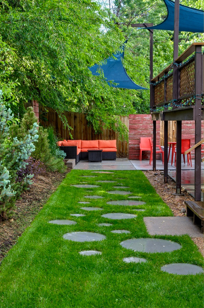 Inspiration for a small modern partial sun backyard landscaping in Denver.