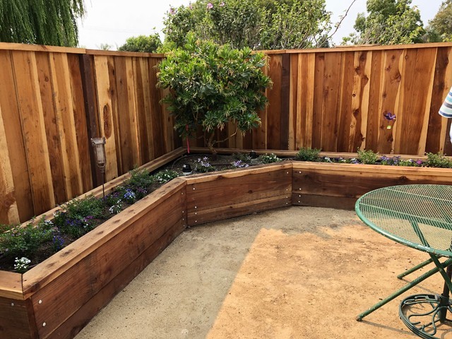 Mid-sized traditional backyard full sun formal garden in San Francisco with gravel and with raised garden bed for spring.