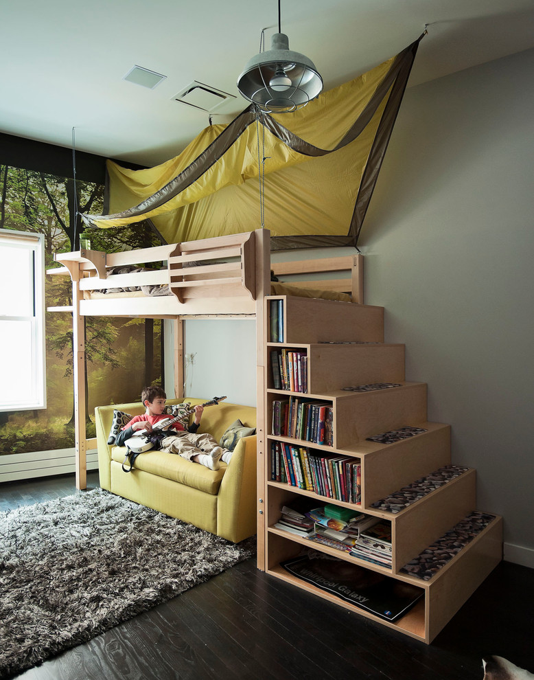 This is an example of a contemporary kids' bedroom for kids 4-10 years old and boys in New York with grey walls and dark hardwood floors.