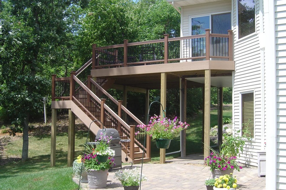Large transitional backyard deck photo in Minneapolis with no cover