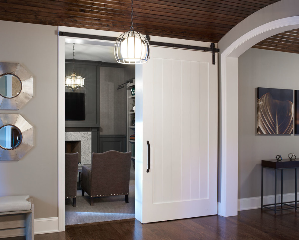 Inspiration for a mid-sized contemporary foyer in Detroit with grey walls, dark hardwood floors, a single front door and a dark wood front door.