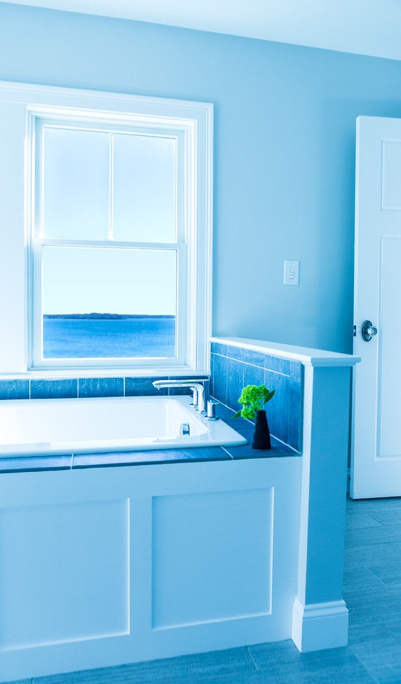Photo of a large beach style master bathroom in Boston with an undermount sink, open cabinets, white cabinets, marble benchtops, a drop-in tub, a corner shower, a two-piece toilet, blue tile, stone tile, blue walls and porcelain floors.