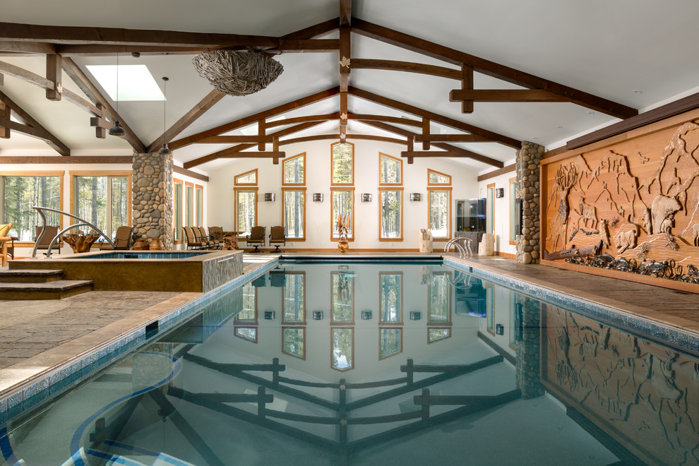 Inspiration for a mid-sized rustic backyard rectangular lap pool house remodel