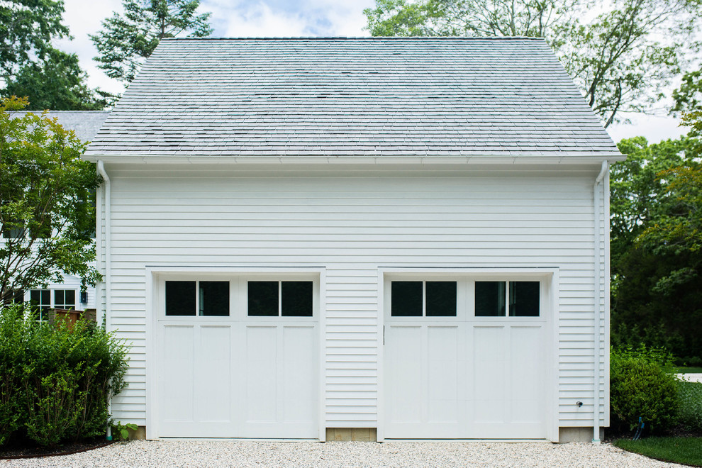 Example of a beach style detached two-car garage design in New York