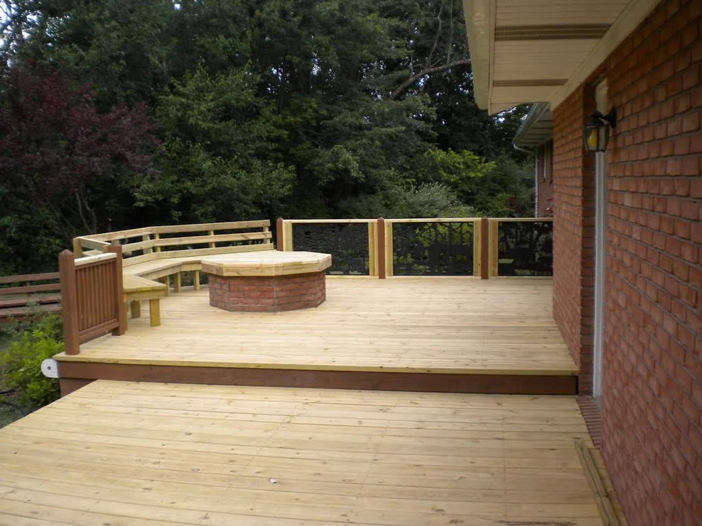 Mid-sized arts and crafts backyard deck photo with no cover