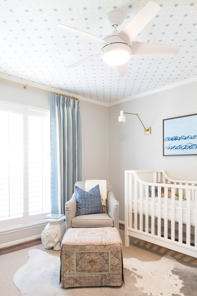 Design ideas for a mid-sized beach style nursery for boys in Houston with grey walls and dark hardwood floors.