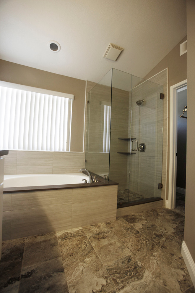 This is an example of a mid-sized contemporary master bathroom in Los Angeles with flat-panel cabinets, white cabinets, a drop-in tub, a corner shower, grey walls, ceramic floors, a drop-in sink and granite benchtops.