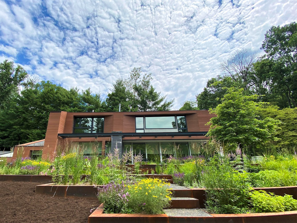 Ispirazione per un grande giardino minimalista esposto in pieno sole dietro casa in estate con ghiaia