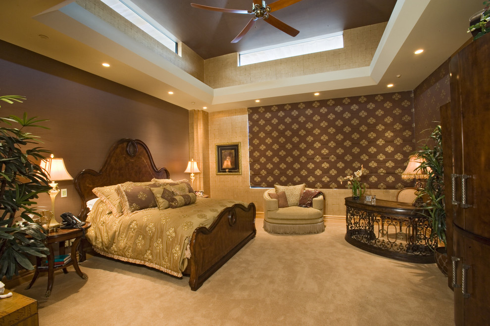 Inspiration for an expansive arts and crafts master bedroom in Las Vegas with beige walls, carpet, beige floor and wallpaper.