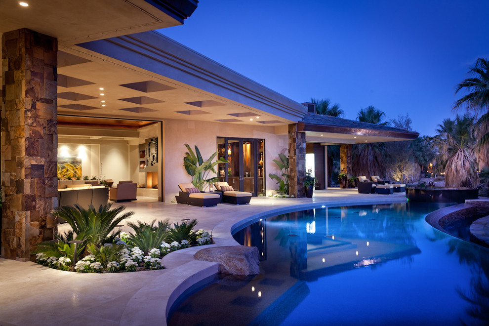 Inspiration for a tropical backyard custom-shaped pool in San Diego.