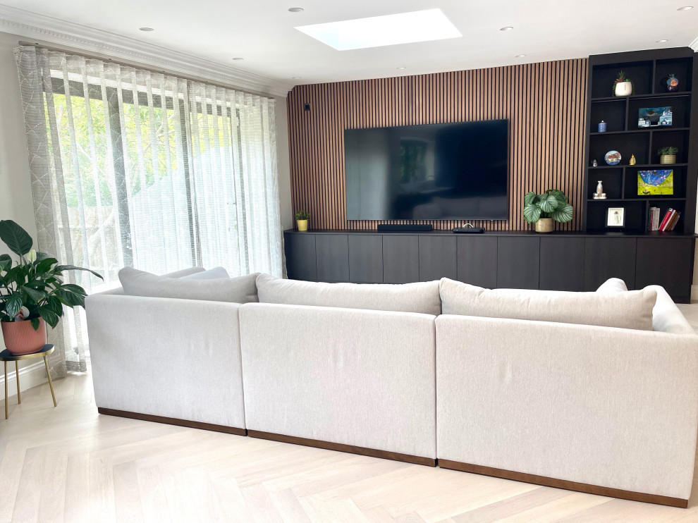 Design ideas for a modern family room in Hertfordshire.