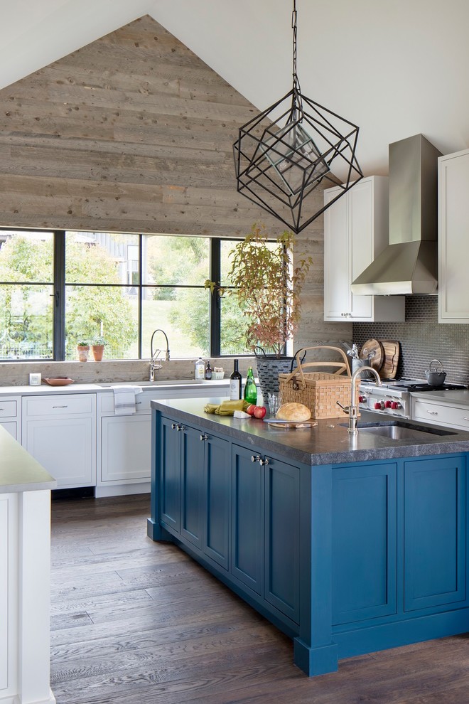 Inspiration for a large rustic u-shaped dark wood floor, brown floor and vaulted ceiling kitchen remodel with shaker cabinets, an island, an undermount sink, white cabinets, gray backsplash, mosaic tile backsplash, stainless steel appliances and gray countertops