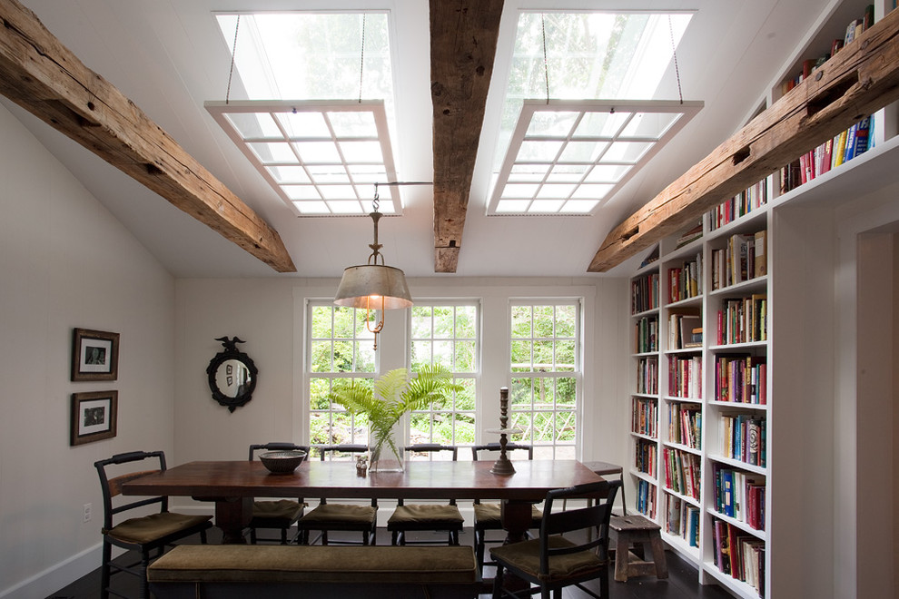 Country dining room in Philadelphia with white walls and dark hardwood floors.