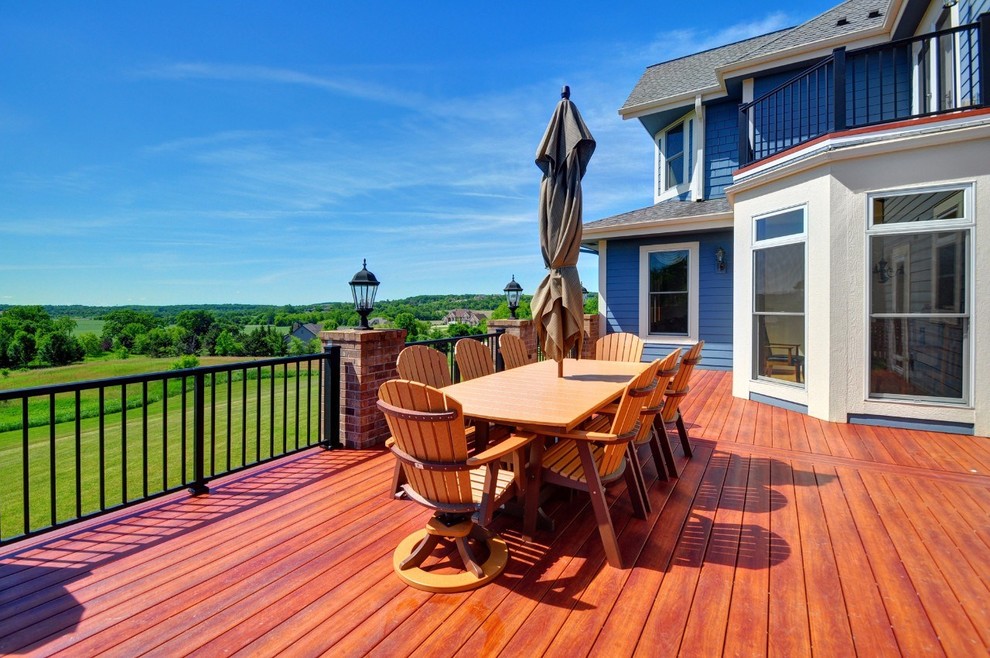 Large contemporary backyard deck in Milwaukee with no cover.