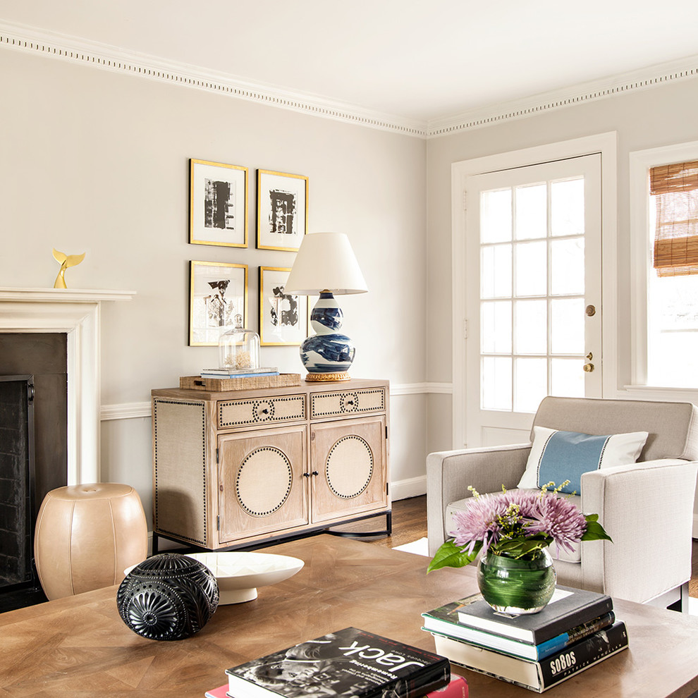 Inspiration for a transitional living room in New York with grey walls, dark hardwood floors and a standard fireplace.