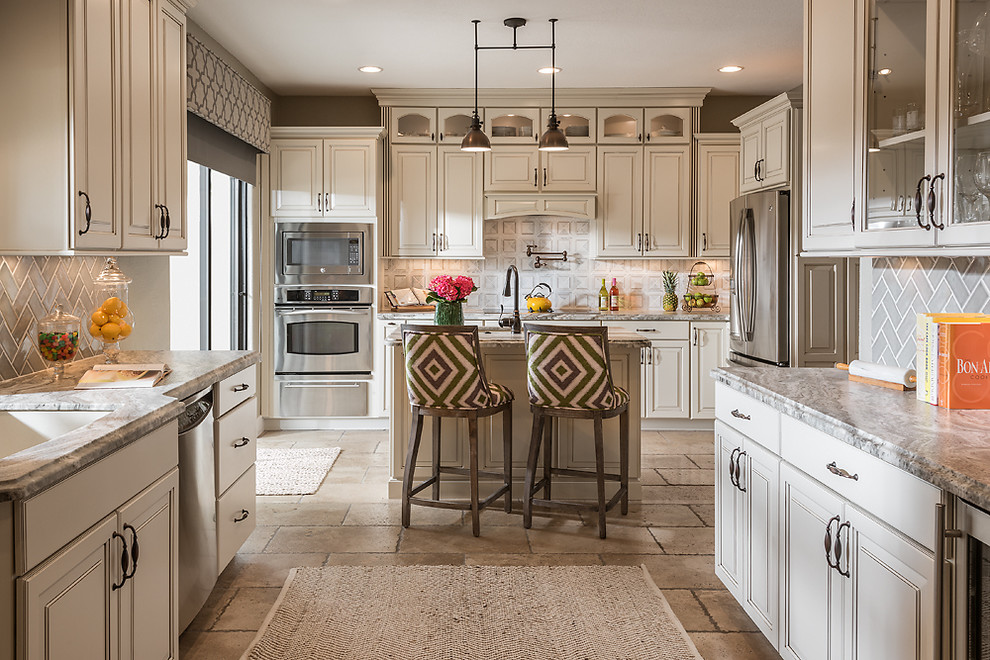 Photo of a mid-sized traditional u-shaped kitchen in Phoenix with raised-panel cabinets, white cabinets, quartzite benchtops and with island.