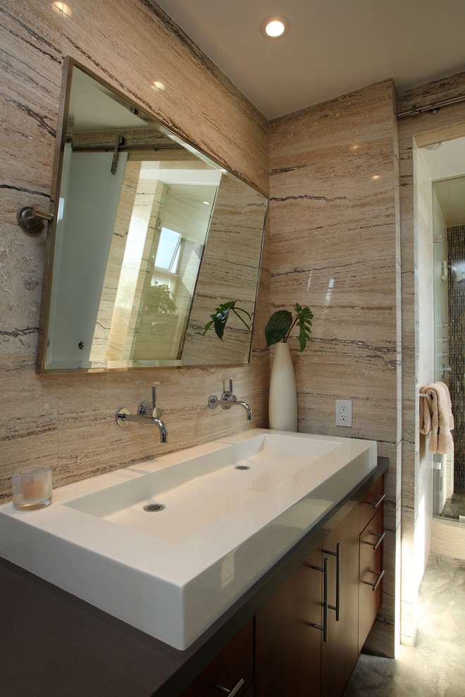 This is an example of a large modern master bathroom in Los Angeles with flat-panel cabinets, dark wood cabinets, a freestanding tub, a curbless shower, grey walls, concrete floors, a vessel sink and grey floor.
