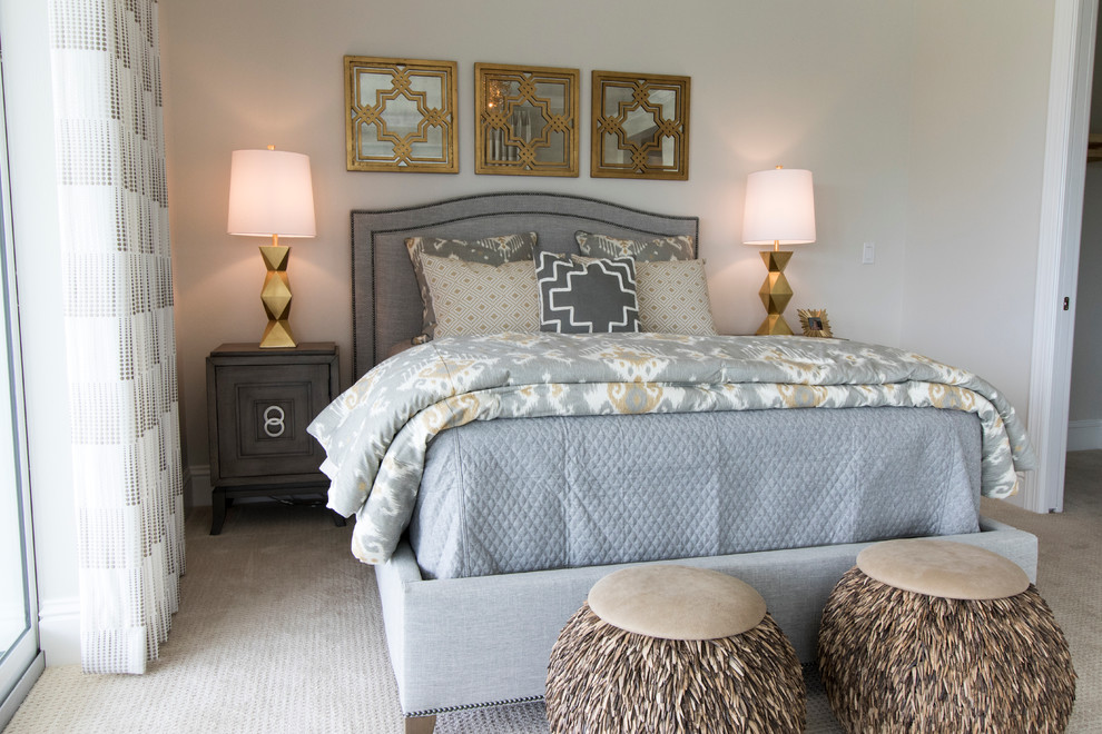 Inspiration for a mid-sized beach style guest bedroom in Miami with beige walls and carpet.