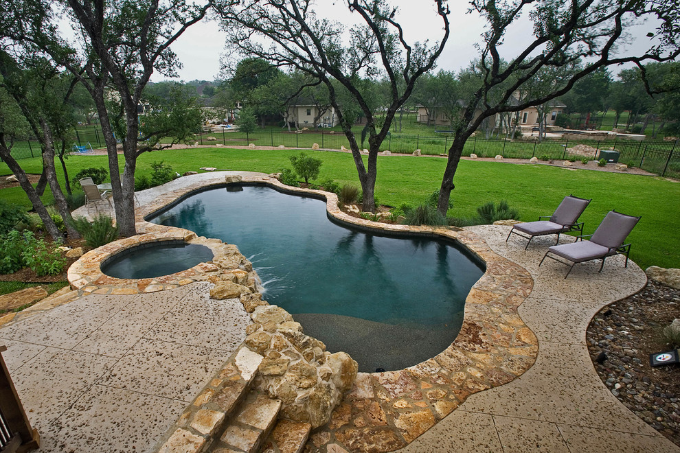 Mid-sized mountain style pool photo