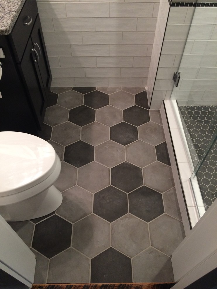 Example of a small transitional master white tile and cement tile porcelain tile alcove shower design with shaker cabinets, dark wood cabinets, black walls, an undermount sink and granite countertops