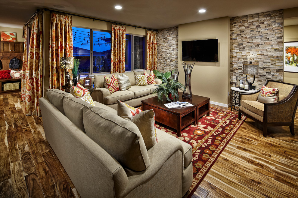 Inspiration for a traditional formal open concept living room in Denver with beige walls, dark hardwood floors and a wall-mounted tv.