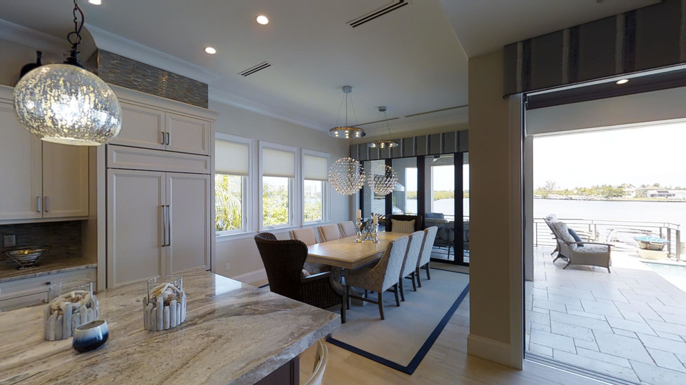 Great room - large transitional ceramic tile and beige floor great room idea with beige walls and no fireplace