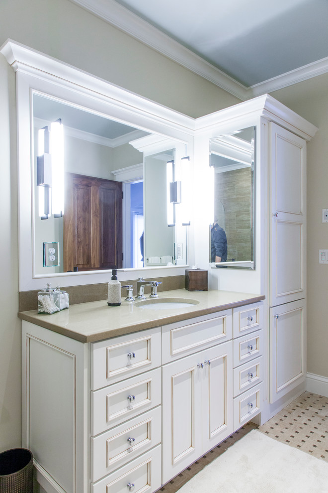 Inspiration for a mid-sized transitional kids bathroom in Burlington with an undermount sink, recessed-panel cabinets, beige cabinets, engineered quartz benchtops, beige tile and beige walls.