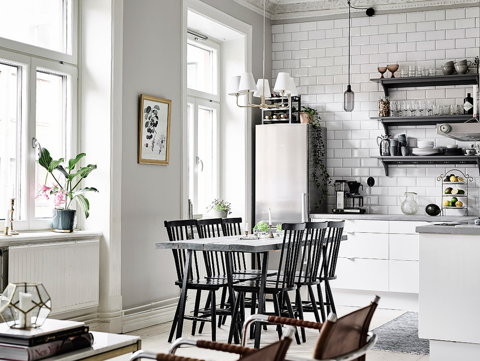 Design ideas for a mid-sized scandinavian kitchen/dining combo in Gothenburg with grey walls, painted wood floors and no fireplace.