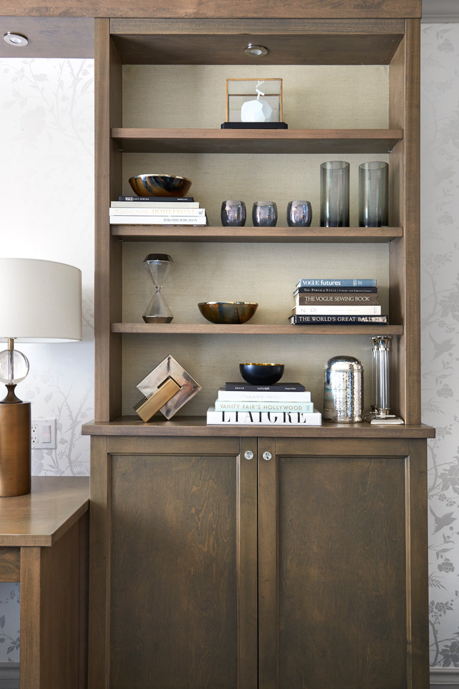 Example of a transitional home office design in Toronto