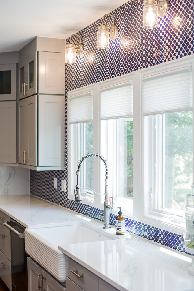 Eat-in kitchen - huge transitional u-shaped eat-in kitchen idea in Denver with shaker cabinets, gray cabinets, quartz countertops, blue backsplash, no island and white countertops