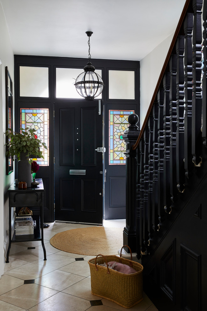 This is an example of a traditional hallway in London with grey walls and porcelain floors.