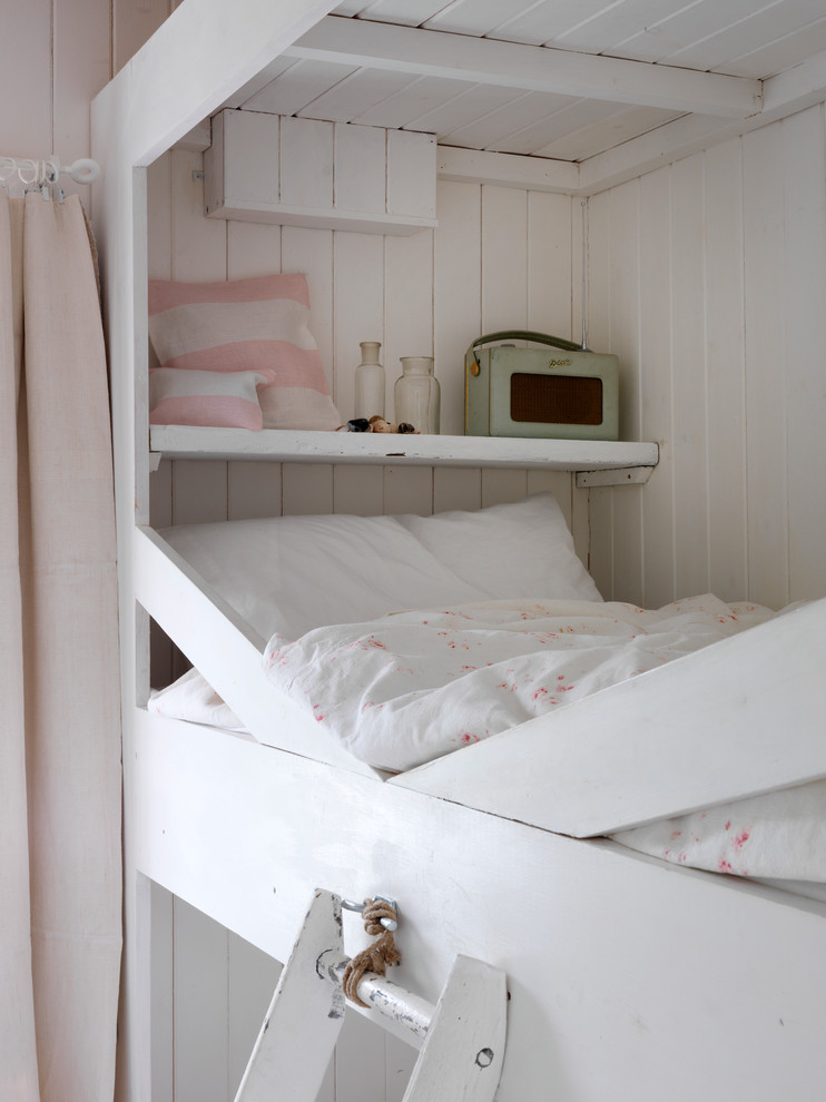 Photo of a beach style bedroom in London.