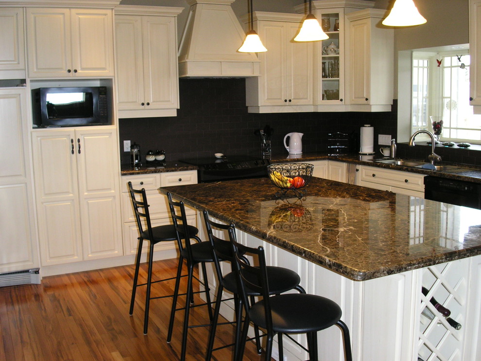 Kitchen - rustic kitchen idea in Calgary with raised-panel cabinets and distressed cabinets