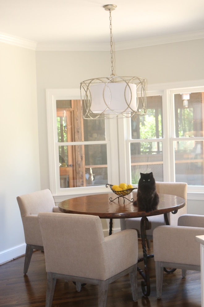 This is an example of a transitional dining room in Birmingham with medium hardwood floors.