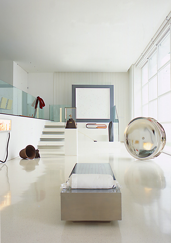 Inspiration for a contemporary living room in DC Metro with white walls and white floor.
