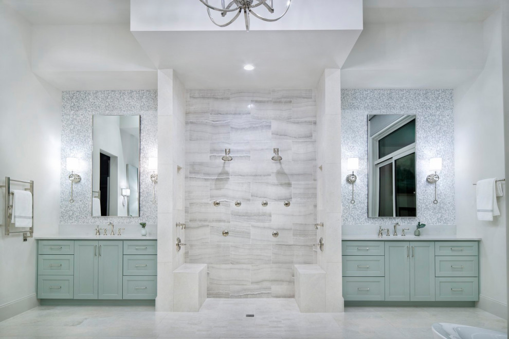 Photo of an expansive country master bathroom in Austin with turquoise cabinets, a double shower, gray tile, white walls, light hardwood floors, multi-coloured floor, an open shower, white benchtops, a double vanity and a built-in vanity.