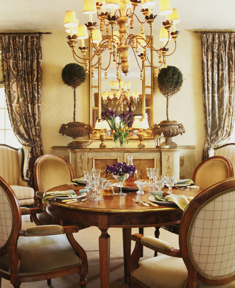 This is an example of a large traditional separate dining room in San Diego with yellow walls.