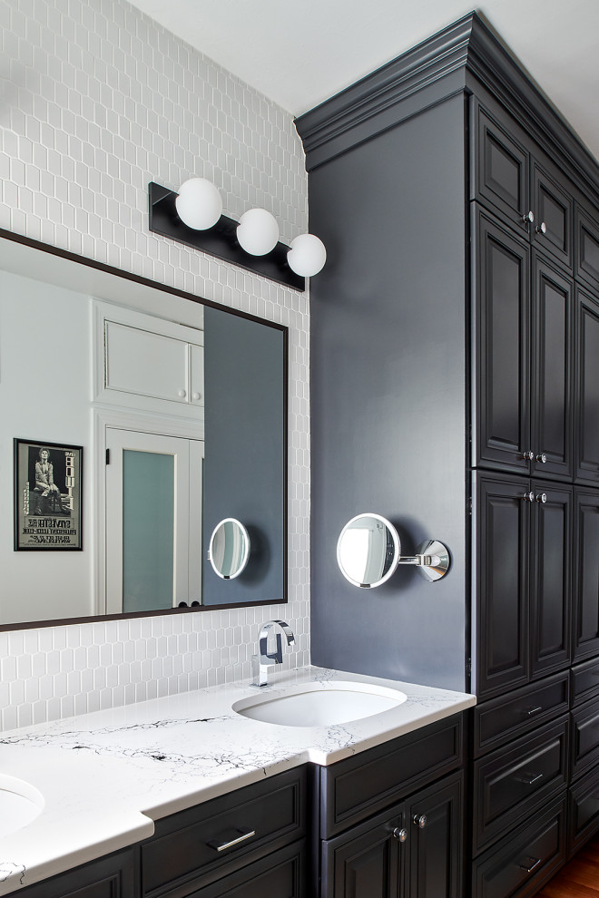 Inspiration for a large contemporary master bathroom in Philadelphia with raised-panel cabinets, black cabinets, black and white tile, ceramic tile, white walls, porcelain floors, an undermount sink, engineered quartz benchtops, black floor, a sliding shower screen, white benchtops, an enclosed toilet, a double vanity and a built-in vanity.