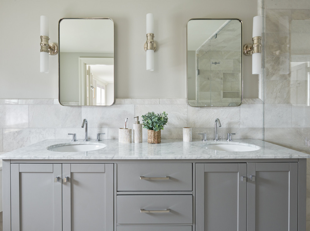 This is an example of a midcentury master bathroom in Other with shaker cabinets, grey cabinets, a curbless shower, gray tile, marble, grey walls, marble floors, marble benchtops, grey floor, a hinged shower door, grey benchtops, a double vanity and a built-in vanity.